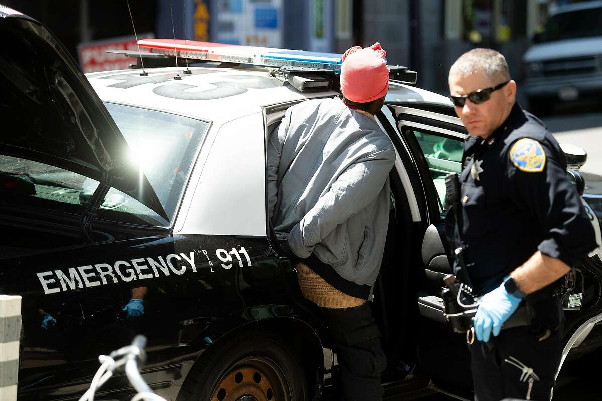 A police officer from SFPD's Tenderloin station make an arrest, not drug-related, on Eddy St. on Thursday, April 25, 2019, in San Francisco.