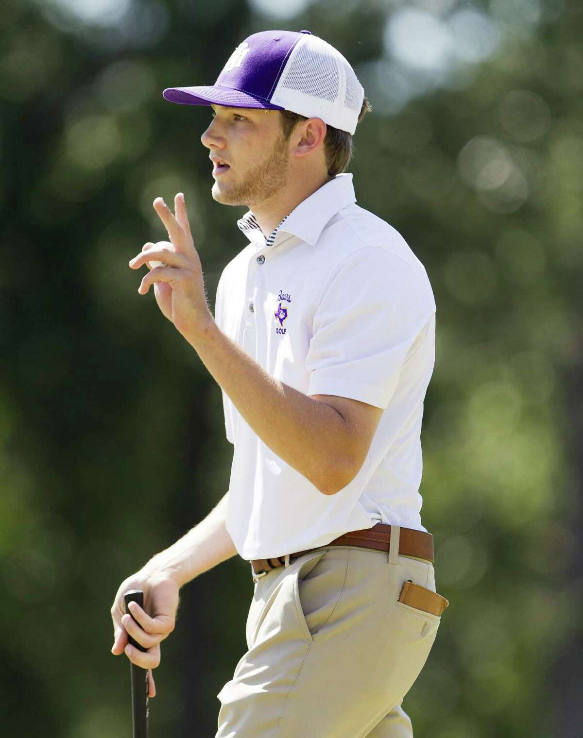 Terrin Anderson of Montgomery acknowledges the crowd after making a par putt 18th green to finish the tournament first overall during the final round of the Region III-5A Boys Golf Championship at the Golf Club at La Torretta, Thursday, April 25, 2019, in Montgomery.