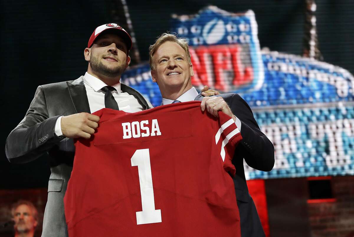 Ohio State defensive end Nick Bosa poses with NFL Commissioner Roger Goodell after the San Francisco 49ers selected Bosa in the first round at the NFL football draft, Thursday, April 25, 2019, in Nashville, Tenn.(AP Photo/Mark Humphrey)