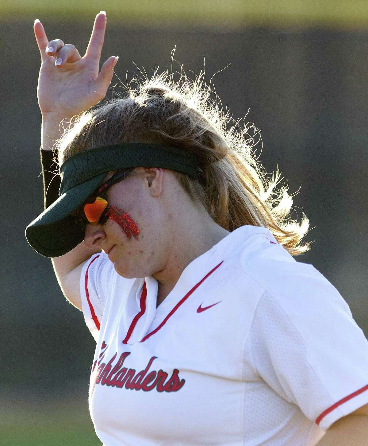 The Woodlands first baseman Carly Allen (30) holds up the number of outs in the third inning of Game 2 during a Region II-6A bi-district softball playoff series at Grand Oaks High School, Thursday, April 25, 2019, in Spring.