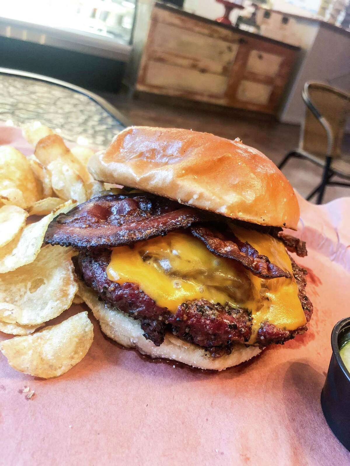 The Smokehouse Burger at Tejas Chocolate & Barbecue in Tomball is available on Wednesdays.