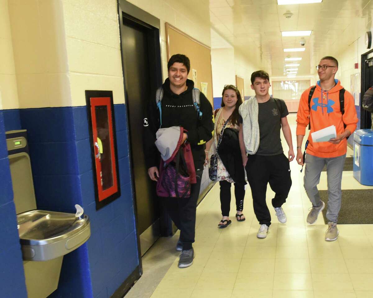 From left, P-Tech students Owais Husain, Monique Beam, Nick Brasmeister and Marcos Santiago from the Hamilton Fulton Montgomery BOCES program walk to class at Fulton Montgomery Community College on Thursday, April 25, 2019 in Johnstown, N.Y. (Lori Van Buren/Times Union)