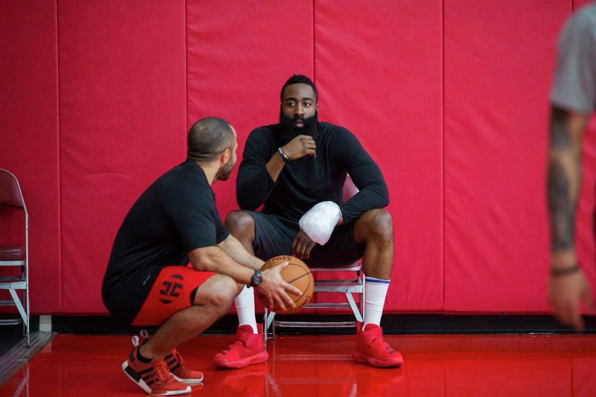 Rockets guard James Harden shows up to a team practice with ice wrapped around his wrist at the Toyota Center on Friday, April 26, 2019, in Houston.