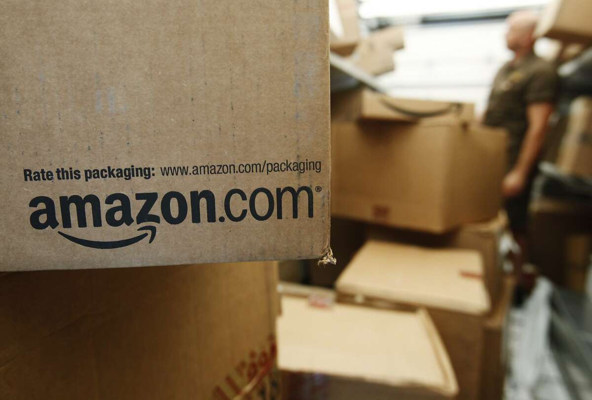 FILE - In this Oct. 18, 2010, file photo, an Amazon.com package awaits delivery from UPS in Palo Alto, Calif. . (AP Photo/Paul Sakuma, File)