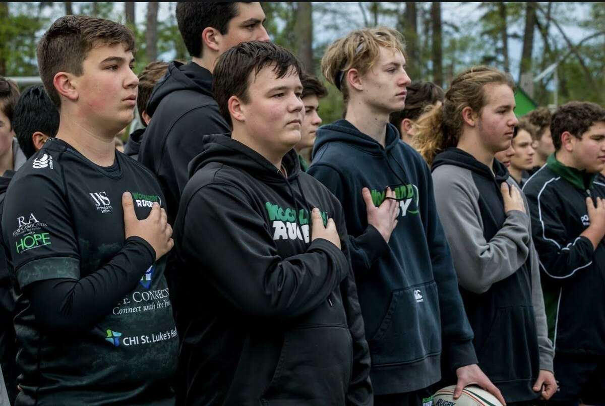 Woodlands Youth Rugby high school players Aidan Hrinsin, Zach Raper, Michael Pineda, Dillan Page, Jett Rozenberg and Grant Stephens stand for the national anthem before the Come and Take It Tournament in March.
