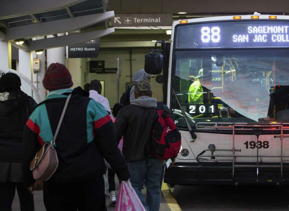 Passengers get on and off a Metropolitan Transit Authority Route 88 bus at William P. Hobby Airport on Jan. 10. Metro, citing politcal and community support, is interested in extending rail lines to Hobby Airport.