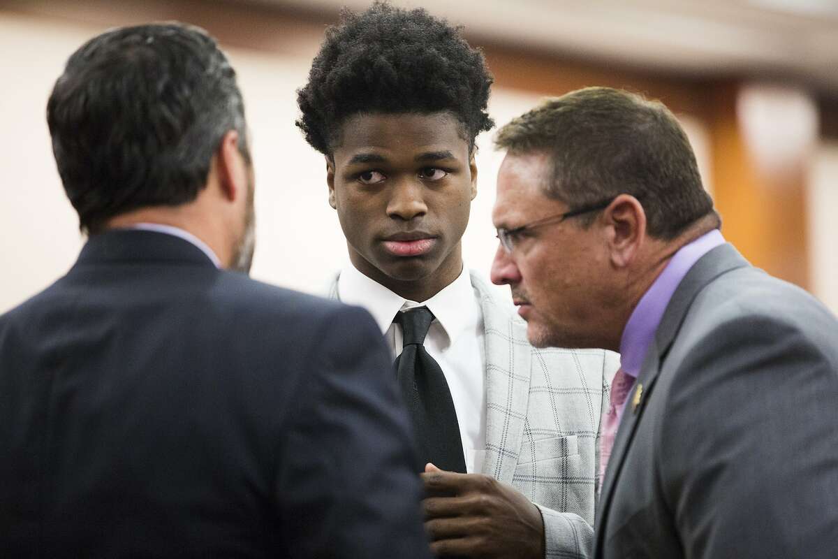 Antonio Armstrong, Jr. talks to his attorneys Rick DeToto and Chris Collings during the third day of deliberations on Friday, April 26, 2019, in Houston. The jury continued to deliberate the fate of Armstrong, Jr., who is accused of killing his parents, Dawn Armstrong and ex-NFL player Antonio Armstrong, Sr., on July 29, 2016 at their Bellaire-area home.