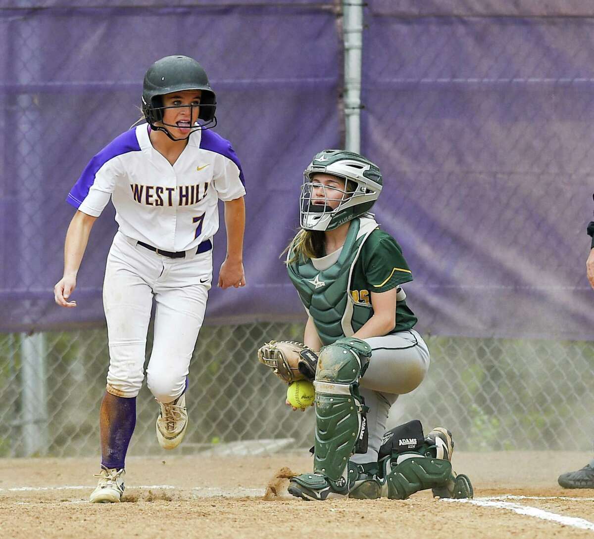Westhill’s Olivia Butler scores on a Trinity Catholic infield error in the bottom of the fourth inning on Thursday. Westhill defeated Trinity Catholic 13-5.