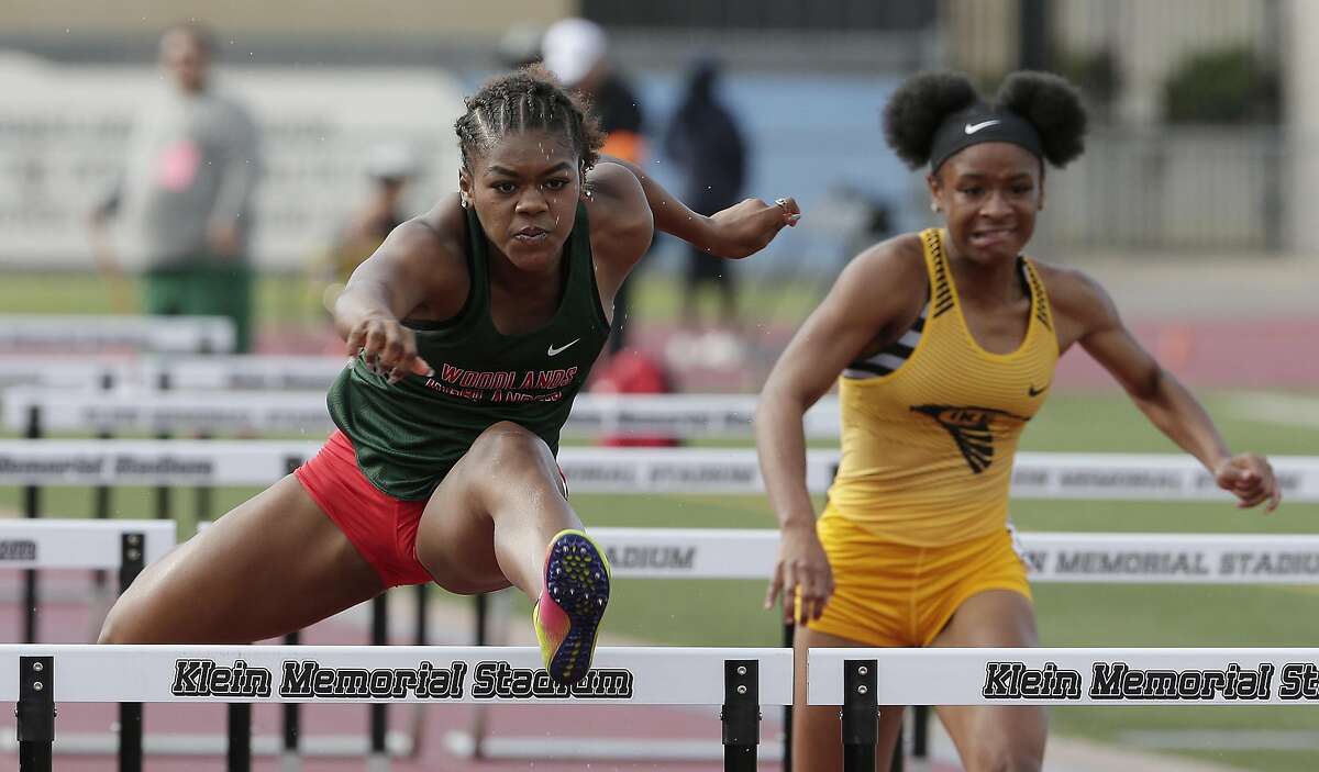 The Woodlands Alexandria Webster is way ahead of Eisenhower's Tytiania Morrison as she runs the Girls 100 Meter Hurdles during the 15/16-6A area Track Championships held at Klein Memorial Stadium Thursday, Apr. 18, 2019 in Spring, TX.