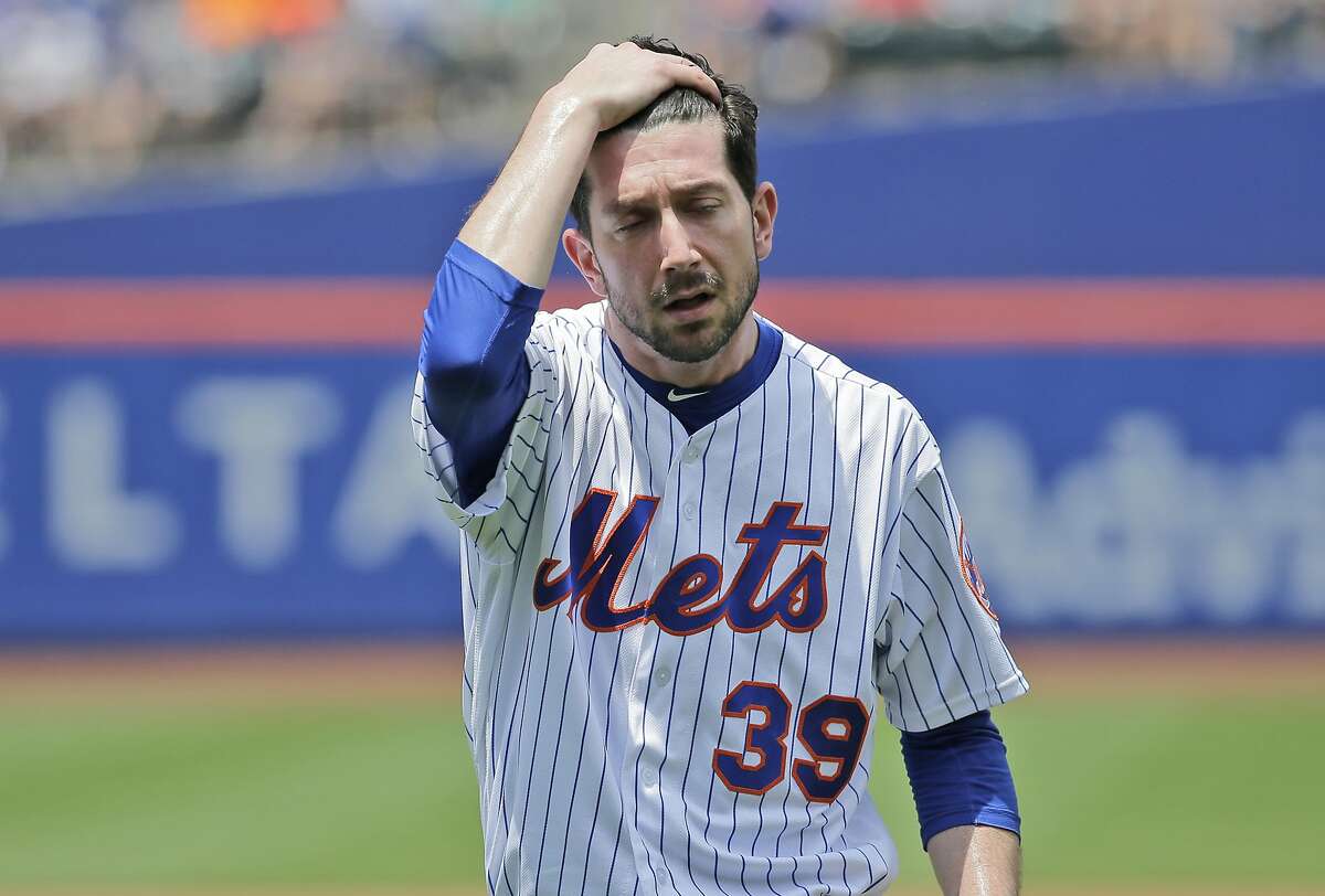 FILE - In this June 24, 2018, file photo, New York Mets pitcher Jerry Blevins leaves the field after the top of the first inning of a baseball game against the Los Angeles Dodgers, at Citi Field in New York. With the Mets sinking fast toward the bottom of the National League standings, baseball operations were turned over Tuesday, June 26, to a trio of Sandy Alderson's assistants as the 70-year-old general manager made the stunning announcement that he was stepping down because his cancer has returned. (AP Photo/Seth Wenig, File)