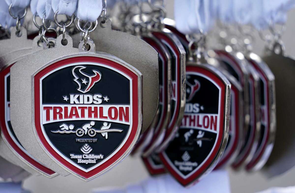 At Houston triathlon for children, parents sweat too
