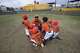 The Little League team called Marlins, based in Ciudad Juárez, gather after winning a game against the Angels on April 5 in Ciudad Juárez.