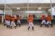 The Marlins dance in front of their audience, which mostly consists of their parents, after winning a game against another Little League baseball team on April 5 in Ciudad Juárez.