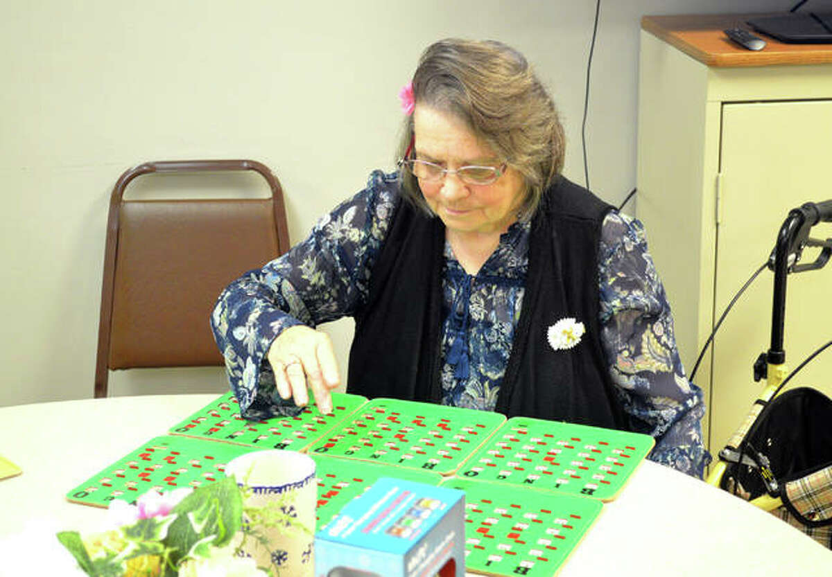 Linda Dillon, of Edwardsville, plays bingo during a Friday afternoon session at Main Street Community Center in Edwardsville.