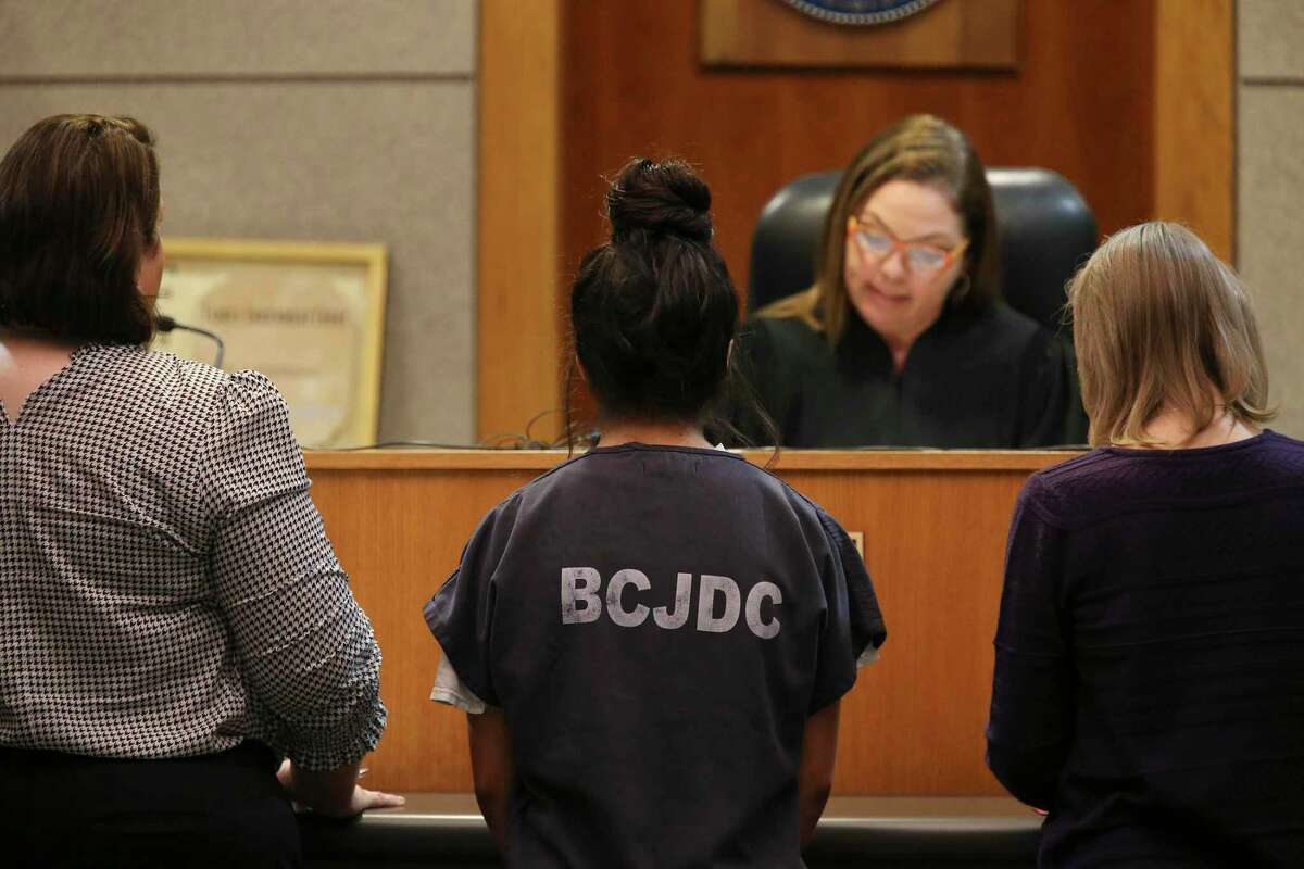 A 16-year-old Madison High School girl stands before 436th Juvenile District Court Judge Lisa K. Jarrett during a hearing on April 29. The girl was accused of stabbing to death Kaitlin Castilleja, 18. The judge ordered an evaluation of the juvenile to determine whether she should be tried as an adult, but charges against her were dismissed Thursday when the DA determined she had acted in self-defense. The girl had been in custody since the death March 1 and was back home Thursday.