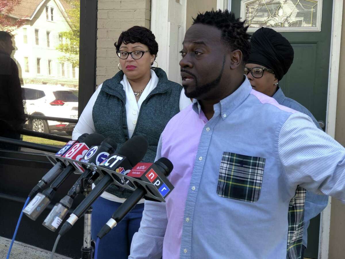 Keisha Greene, right rear, mother of Paul Witherspoon; her fiancée, Jasmine Evans, left rear; and uncle Rodney Williams, held a news conference Monday to speak publicly amid the sweeping reaction to an April 16 police shooting in New Haven, which targeted Witherspoon and left his girlfriend, Stephanie Washington, wounded.