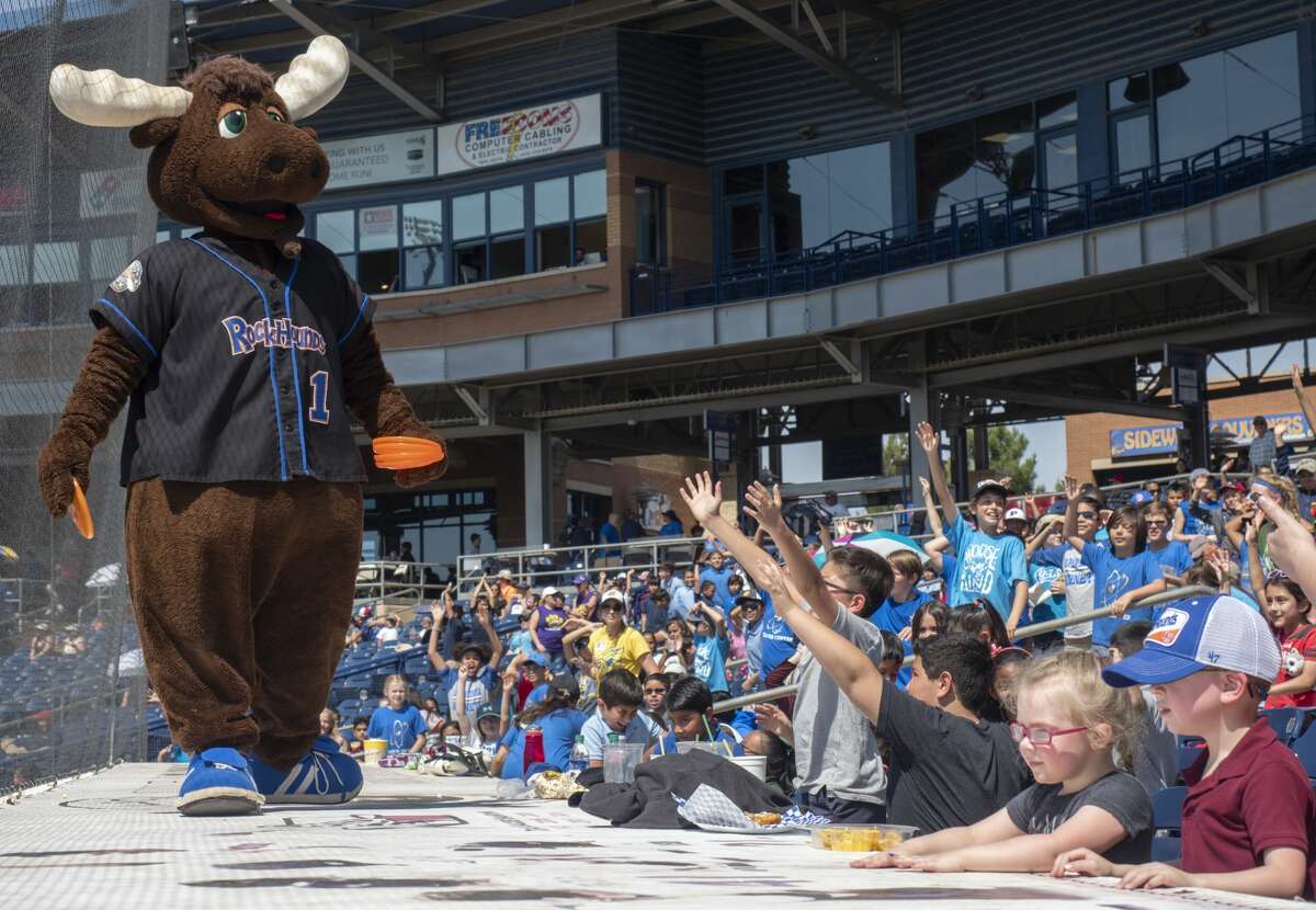 Juice the Moose tosses frisbees to fans during a day game with the Midland RockHounds in this file photo. Tim Fischer/Reporter-Telegram