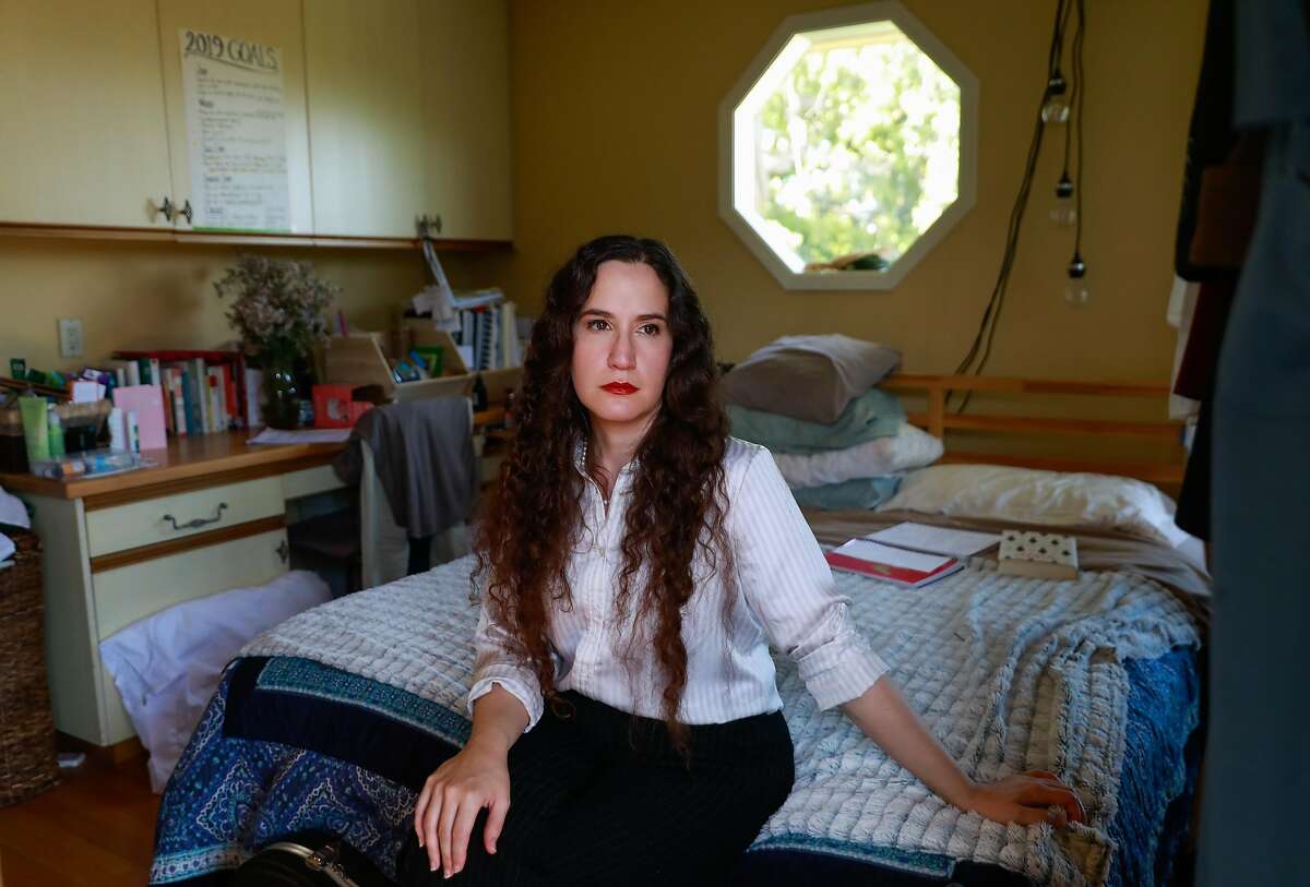 Jaime Seltzer who has myalgic encephalomyelitis poses for a portrait in her room in Los Altos Hills, California, on Monday, April 29, 2019.