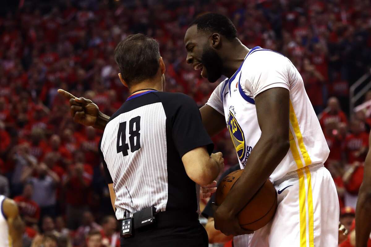Draymond Green argues with referee Scott Foster after being called for a foul in the first quarter against the Houston Rockets in Game One of the Western Conference Finals of the 2018 NBA Playoffs.