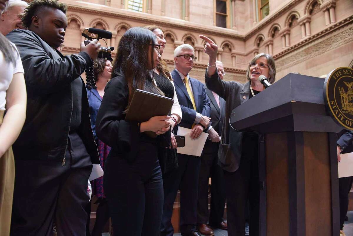 Assemblymember Donna Lupardo, at podium, the sponsor of the Student Journalist Free Speech Act in the Assembly, and Senator Brian Kavanagh, behind podium, the sponsor of the bill in the Senate, take part in a press conference at the Capitol with high school journalism students on Tuesday, April 30, 2019, in Albany, N.Y. Student journalists from six high schools around New York State gathered at the Capitol on Tuesday for Student Press Day. The students were there to push for passage of the Student Journalist Free Speech Act. (Paul Buckowski/Times Union)