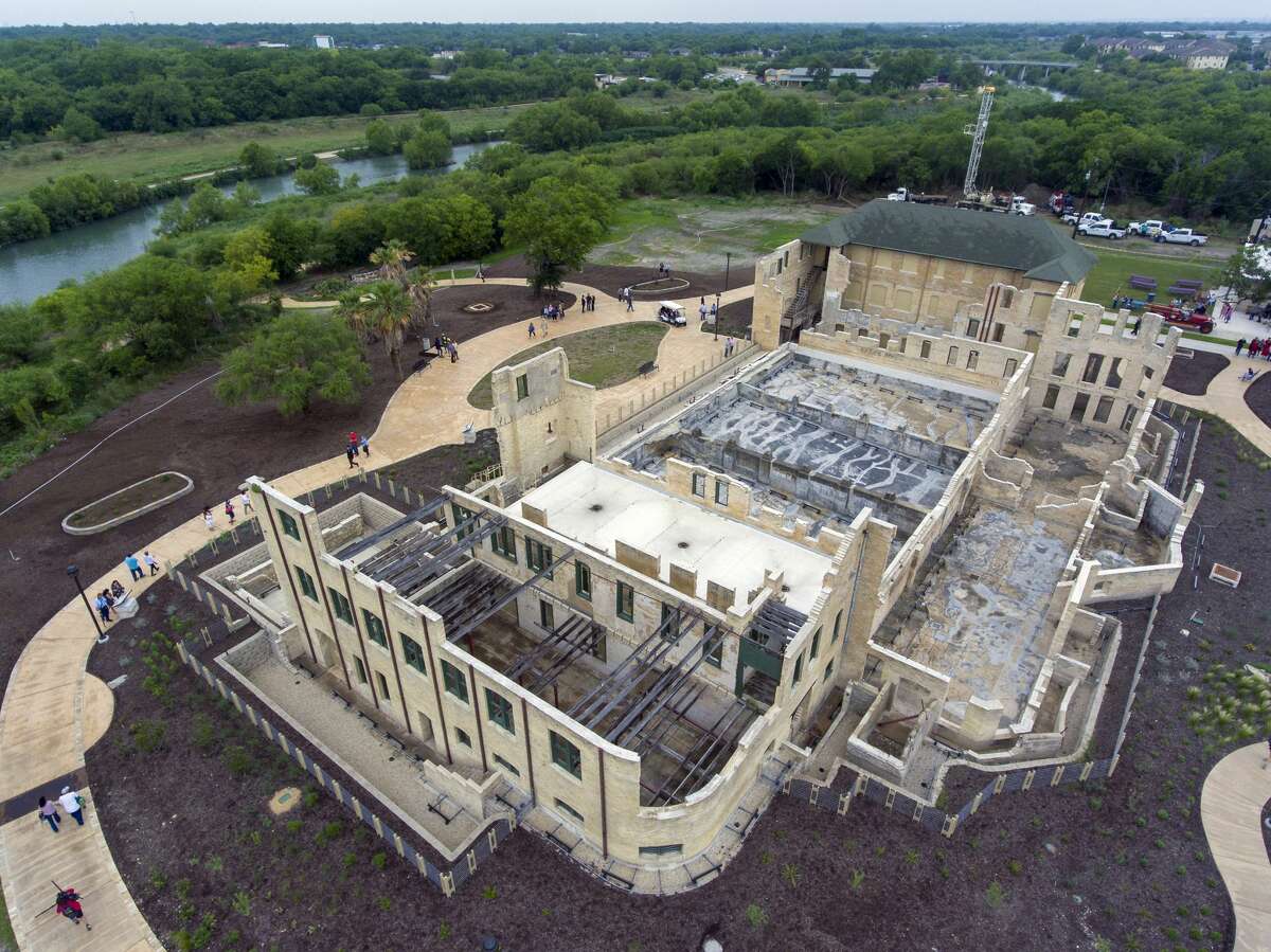 The former Hot Wells Hotel is seen Tuesday, April 30, 2019, during the grand opening of the Hot Wells of Bexar County park. The once-crumbling building has been stabilized by Bexar County as part of turning the approximately four acre site into a park which is connected to the Mission Reach section of the San Antonio River Walk.
