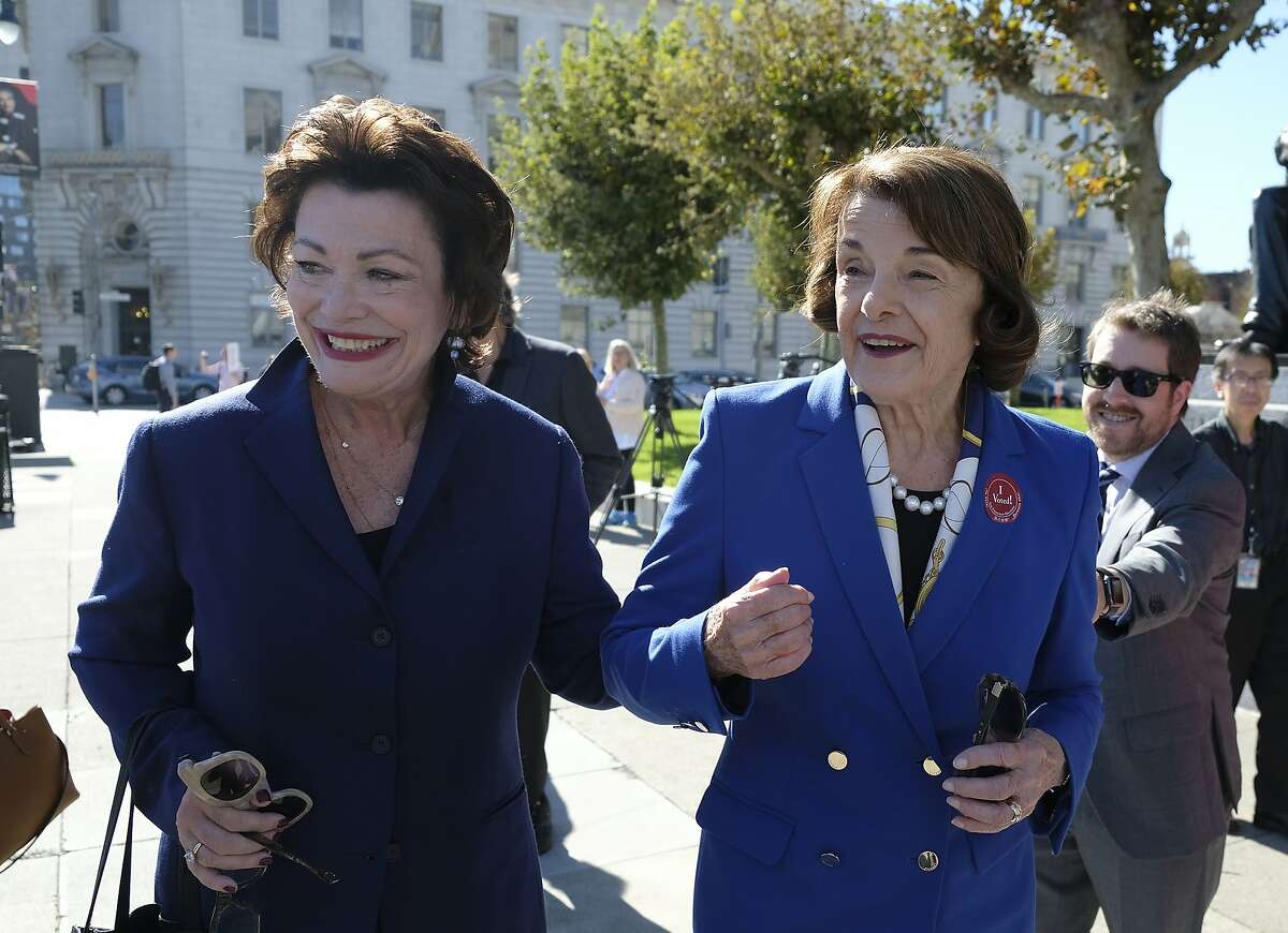 File - In this Nov. 5, 2018, file photo, U.S. Sen. Dianne Feinstein walks with former Congresswoman Ellen Tauscher outside City Hall in San Francisco. Former Democratic Rep. Ellen Tauscher of California, a trailblazer for women in the world of finance who served in congress for more than a decade before joining the Obama Administration, has died of complications from pneumonia. She was 67. Her family said in a statement Tuesday that Tauscher died Monday, April 29, 2019, at Stanford University Medical Center. (AP Photo/Eric Risberg, File)
