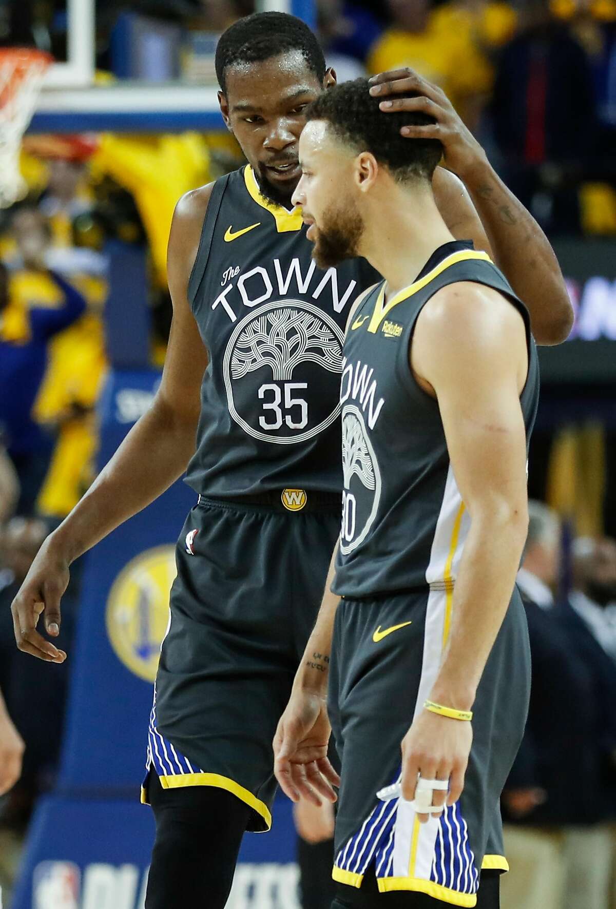 Golden State Warriors Kevin Durant talks with Stephen Curry in the fourth quarter during game 2 of the Western Conference Semifinals between the Golden State Warriors and the Houston Rockets at Oracle Arena on Tuesday, April 30, 2019 in Oakland, Calif.