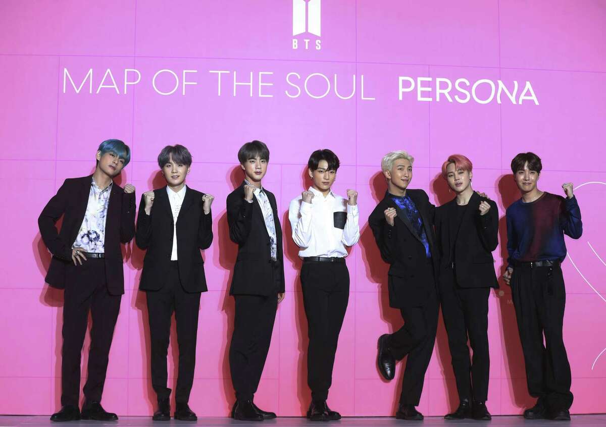 Members of South Korean K-Pop group BTS pose for photos during a press conference to introduce their new album "Map of the Soul: Persona" in Seoul, South Korea, Wednesday, April 17, 2019.