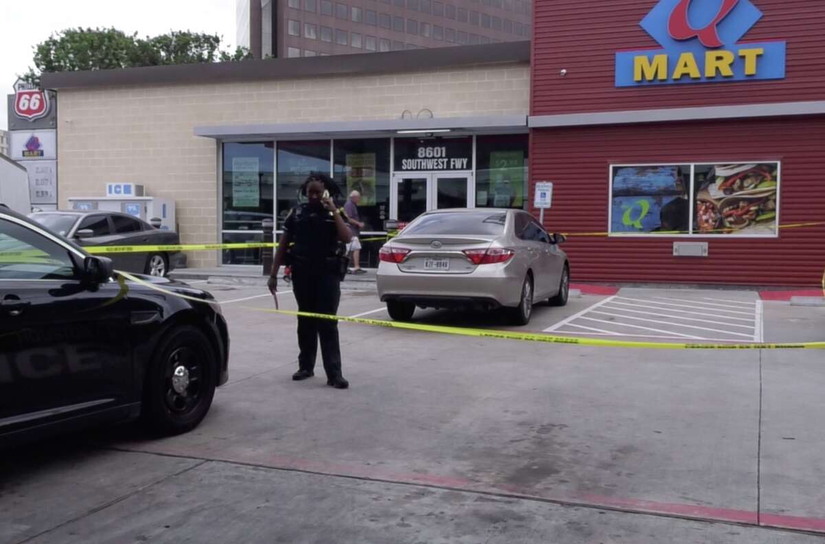 Houston police officers investigate a shooting that injured a small child at a southwest Houston gas station on Wednesday, May 1, 2019.
