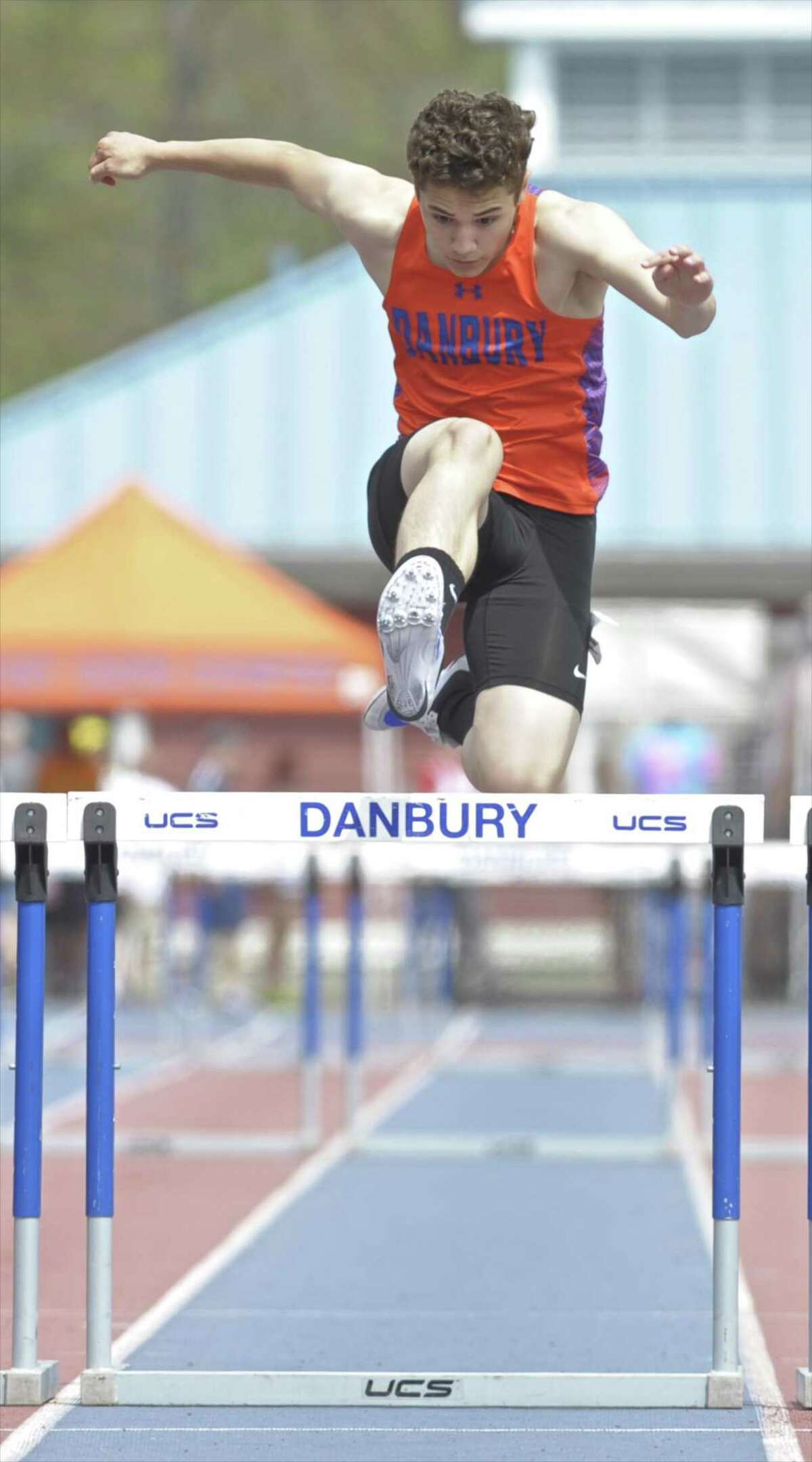 Danhbury’s Jaden Cazorla competes in the 300-meter hurdles during the O’Grady Relays on April 29, 2017 at Danbury High School.