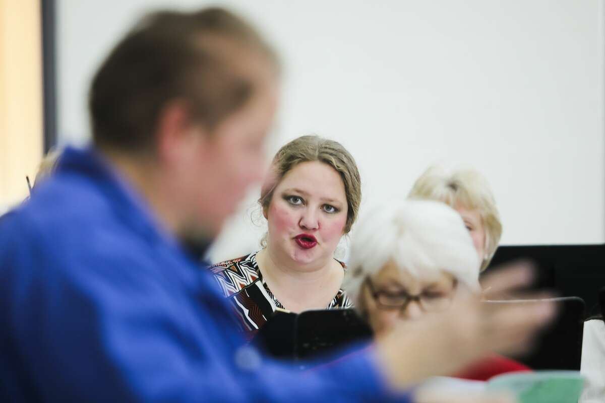 Sara Glynn-Dishaw practices a song along with the rest of the Harmony Diversity Choir on Sunday, April 7, 2019 at Midland High School during a rehearsal for an upcoming concert called "Brave New Voices." (Katy Kildee/kkildee@mdn.net)