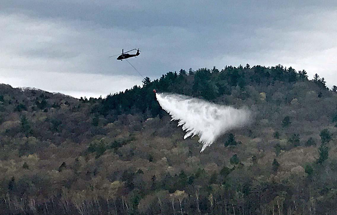 Black Hawk helicopters used in aerial water bucket training