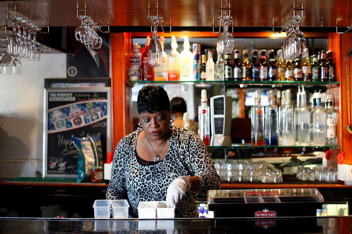 Bartender Denise Tucker gets ready to open at Sam Jordan's Bar in San Francisco, Calif., Monday, January 21, 2013. The bar recently obtained landmark status.