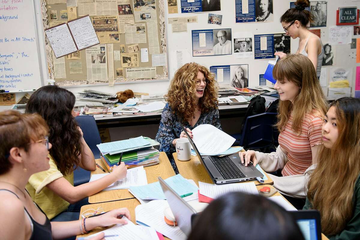 English teacher Kathi Duffel, the faculty adviser for the Bruin Voice student newspaper, works with journalism students as they layout the paper at Bear Creek High School in Stockton, Calif, on Wednesday, April 24, 2019. The Stockton school district is threatening to fire Kathi Duffel, faculty adviser for the Bruin Voice student newspaper, if she doesn't show them a certain story in advance, violating the papers First Amendment freedom of the press rights.