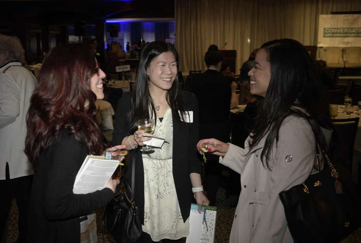 Alicia Ghio, of Rmedia, left, Angela Wong, of CityCenter Danbury, and Lorena Ceballos, of Newtown Savings Bank, during the reception for Conversations with Extraordinary Women, sponsored by the Woman's Business Council. Wednesday, May 1, 2019, in The Amber Room, Danbury, Conn.
