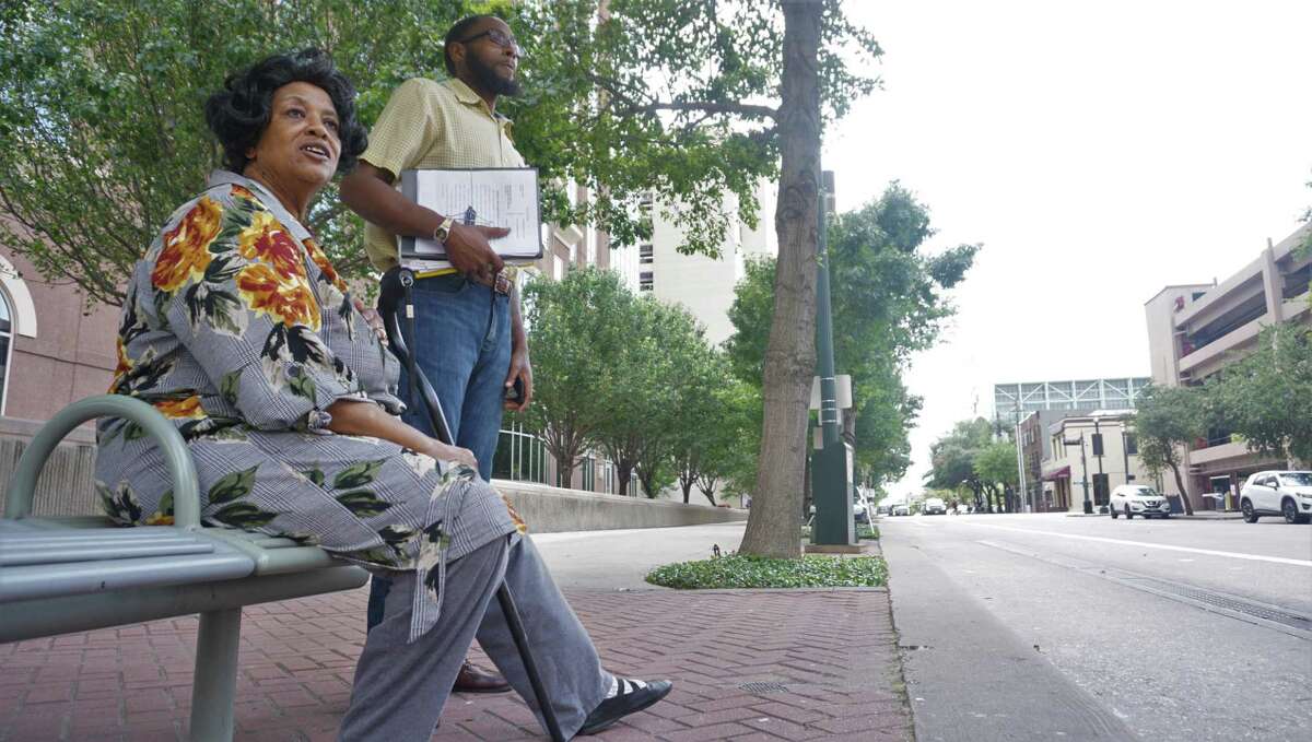 Shirley Crew and Steve Perkins wait for Charlecia Johnson's car by the courthouse on May 2 in Houston.