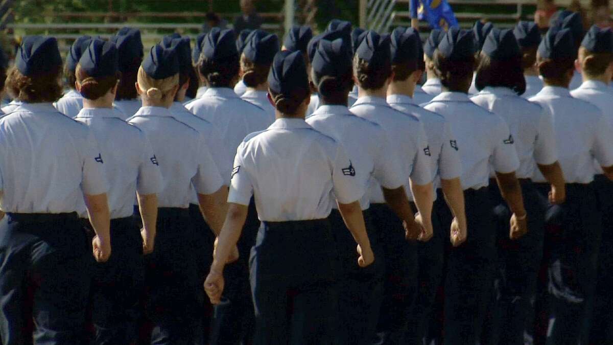 In this June 22, 2012, image made from video, female airmen march during graduation at Lackland Air Force Base in San Antonio. A sex scandal rocked Lackland, one of the nation's busiest military training centers. (AP Photo/John L. Mone)