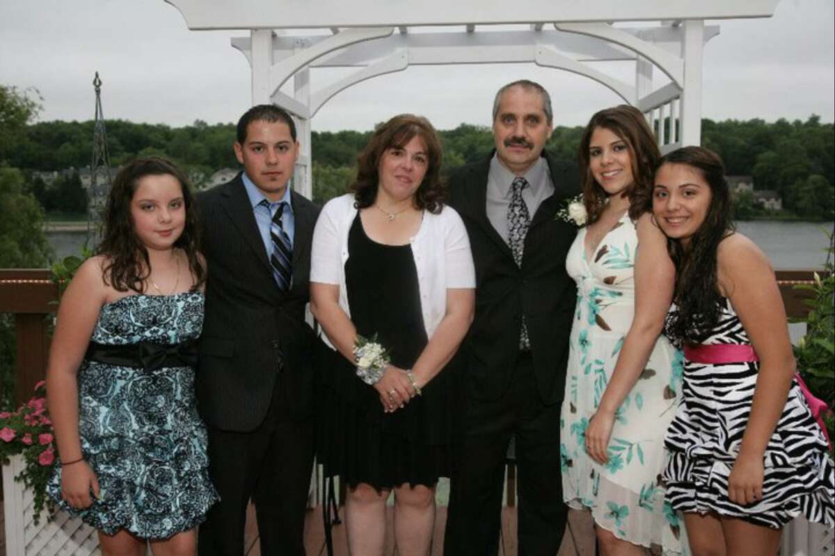 From left to right: Brittany Ashe, Manny Teixeira, Sandi Teixeira, Manuel Teixeira, Krystle Hart and Brianna Teixeira. Manuel Teixeira died by suicide seven years ago. Krystle Hart, his daughter, is starting a suicide support group in Danbury.