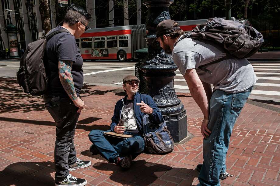 April 26, 2019 -Baron Feilzer and Vicki Lucas, an interventionist, speaks to a homeless man who goes by the name “Seven” in search of his homeless brother Tyson. Tyson was quoted, with photo, in a story earlier this month -- and Baron has flown out from Ohio to find him. He had lost track and want to save him through rehab.  Seven claimed to know Tyson well and offered to get him the message when he saw him. (Nick Otto Special to the Chronicle) Photo: Nick Otto / Special To The Chronicle