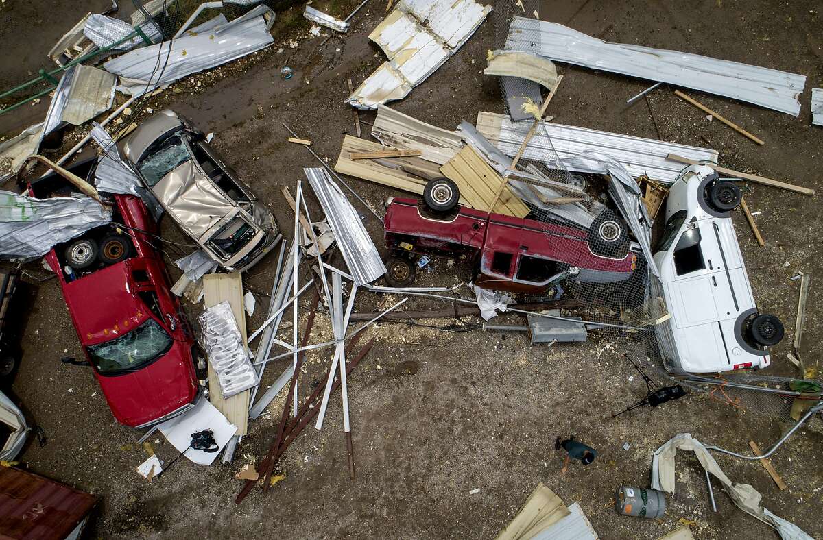 Vehicles are tossed around at McCourt & Sons Equipment Inc. after a tornado tore through the area in La Grange, Texas, on Friday May 3, 2019. (Jay Janner/Austin American-Statesman via AP)