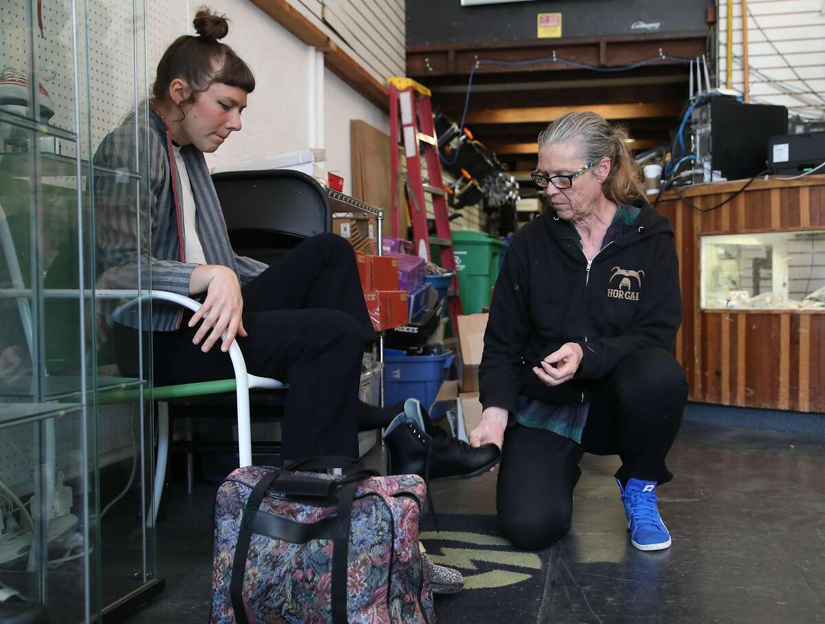 Owner Carol Sloan (right) talks with customer skater girl Gayle Walsworth (left) as she tries on a pair at Skates on Haight on Thursday, April 25, 2019, in San Francisco, Calif. Skates on Haight, a 45-year-old skate shop in the Haight, is looking for a co-tenant to share their space because of the rising cost of rent.