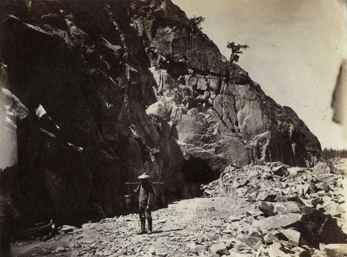 A Chinese immigrant laborer is depicted in an undated photo at the site of a tunnel under excavation as part of the construction of the Transcontinental Railroad.