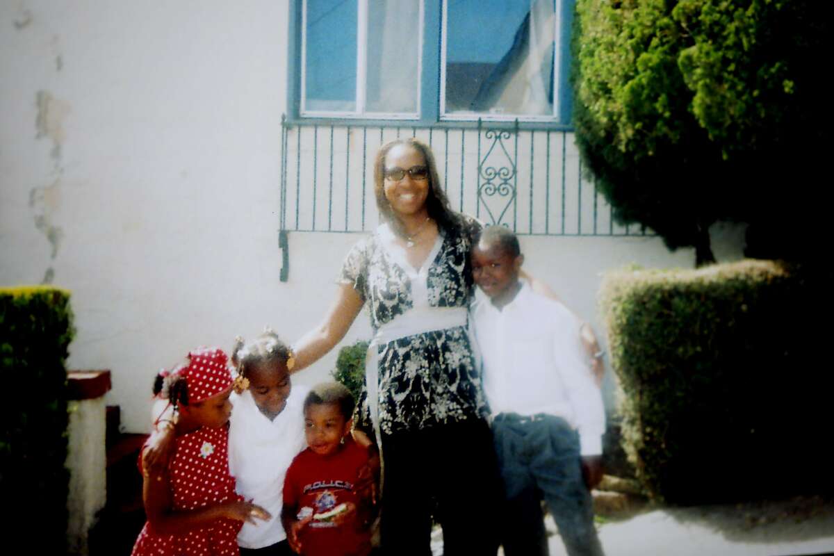 In this undated family photo, Deyana Jenkins (second from left) is held by her mother, Deborah McCoy, while she gives her brother-in-law, Willie McCoy (right) a hug. On April 16, Jenkins was violently arrested by the Vallejo Police Department during a traffic stop. Her uncle, Willie McCoy, was fatally shot by Vallejo police officers as he slept in his vehicle on February 9. Many Vallejo residents have demanded police reform because of troubling arrests and fatal shootings by the VPD. "For one, I was really scared. I was nervous. I was thinking like, 'Lord, please don't let them shoot me. I hope this is not like my last good-bye ... seeing my friends,' " Jenkins said. "I was just really, just trying to stay cooperative."