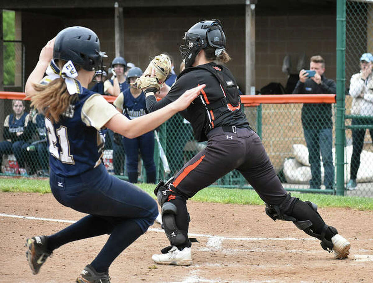Edwardsville catcher Moe Kastens fires a throw to first to complete a 1-2-3 double play.