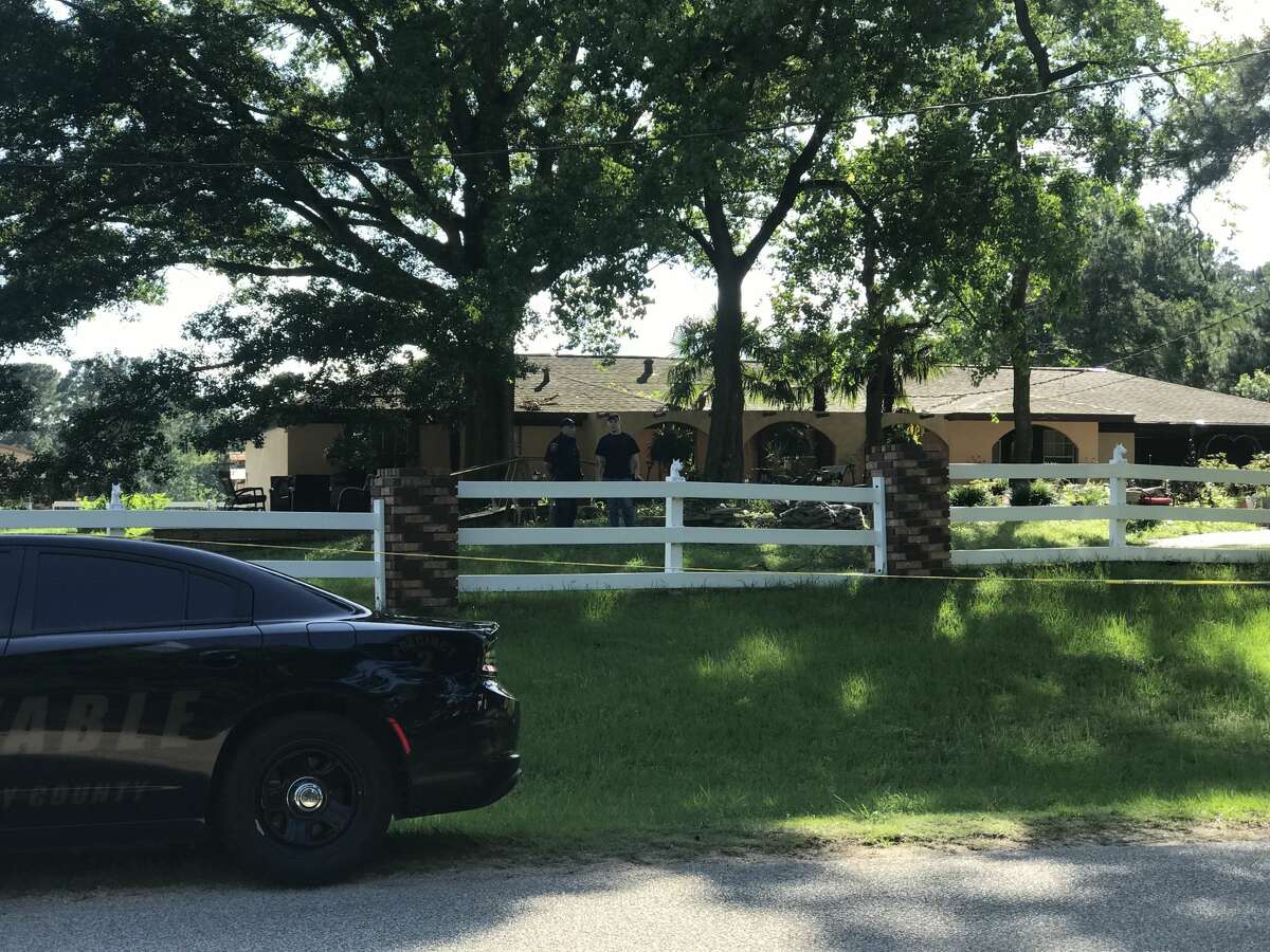 Deputies cordon off the area in the 10700 block of Stidham Road in Conroe, Texas. A 10-year-old boy was shot and killed, and a juvenile is being questioned in his death.
