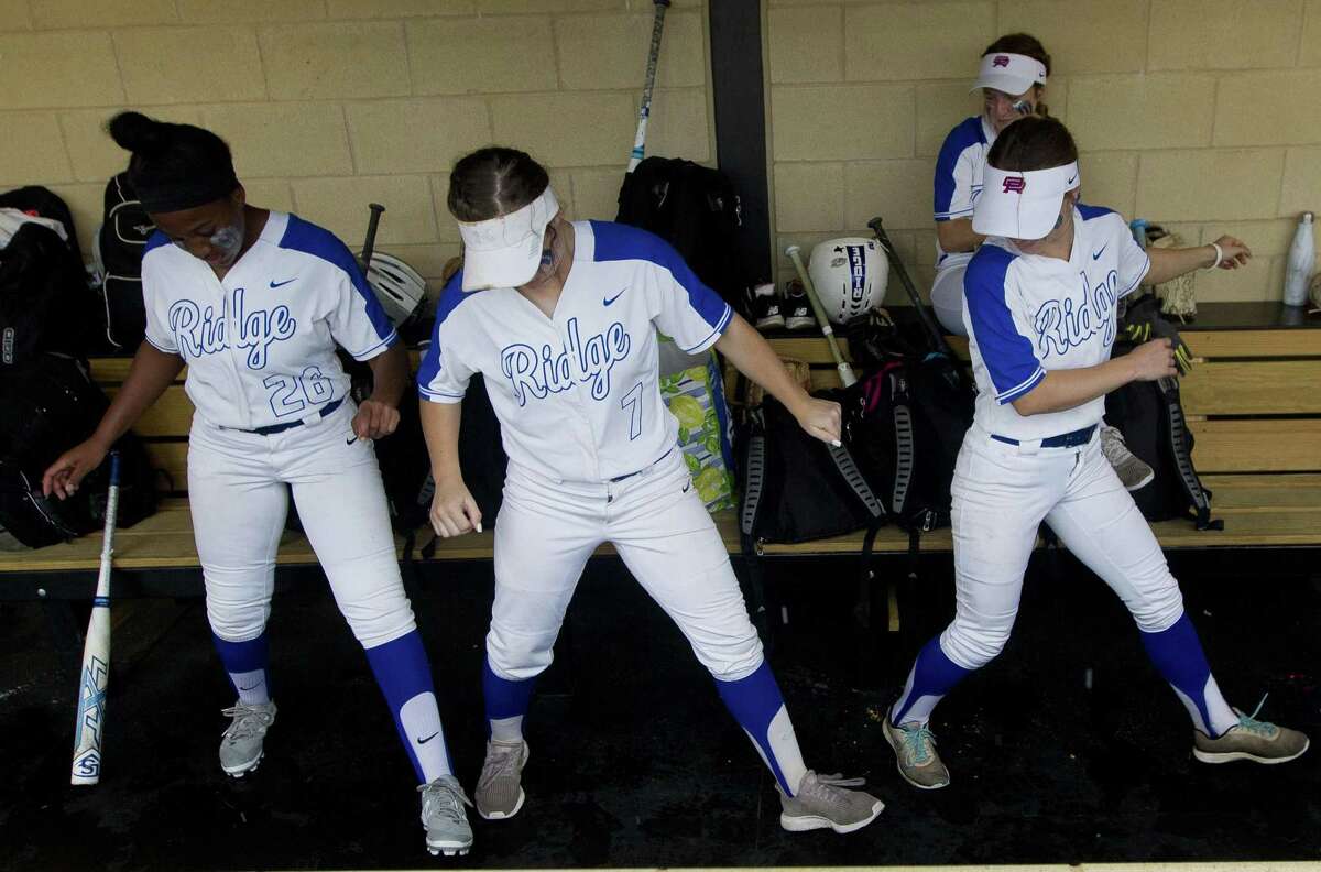 Macee Cobb #7 of Oak Ridge dances beside teammates before Game 1 of Region II-6A area high school softball playoff series at Grand Oaks High School, Friday, May 3, 2019, in Spring.