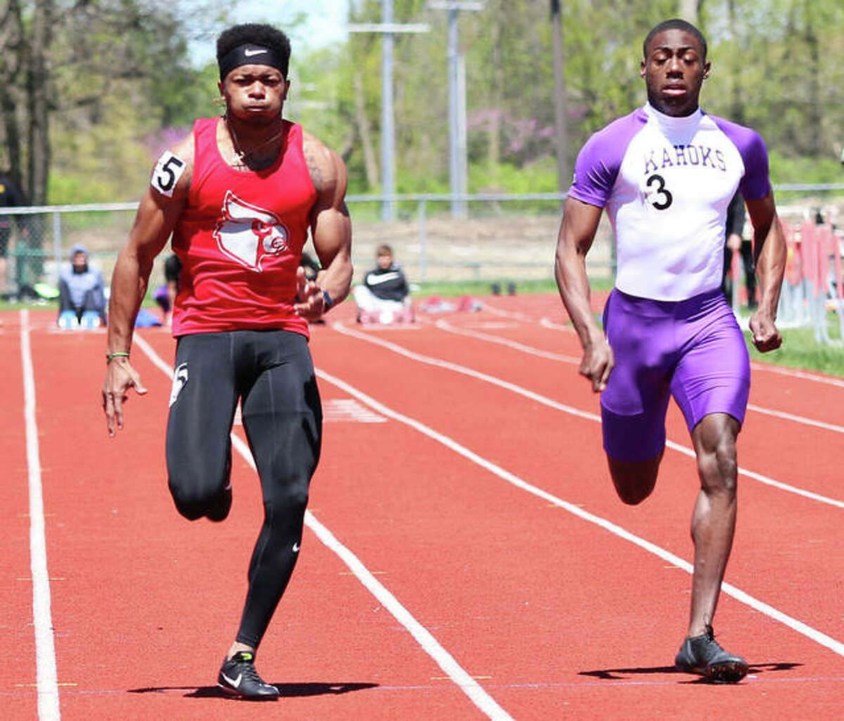 Alton’s Deonte McGoy (left) beats Collinsville’s Jermarrion Stewart to the finish in the 100 meters on April 20 at the Winston Brown Invitational. After Stewart lost to McGoy on both the 100 and 200 in their last two invitational matchups, Stewart picked up wins in both races over McGoy on Saturday at the Collinsville Invite.