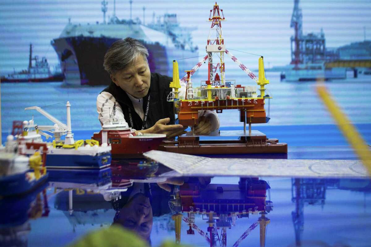 Lin Duosen of the China National Offshore Oil Corporation prepares a model to be transported on the last day of Offshore Technology Conference 2018, Thursday, May 3, 2018, in Houston. ( Marie D. De Jesus / Houston Chronicle )