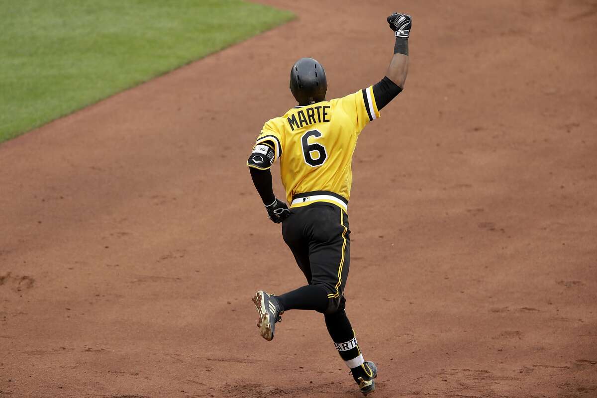 Pittsburgh Pirates' Starling Marte rounds first base after hitting a three-run walkoff home run off Oakland Athletics relief pitcher Fernando Rodney in the 13th inning of a baseball game in Pittsburgh, Sunday, May 5, 2019. (AP Photo/Gene J. Puskar)