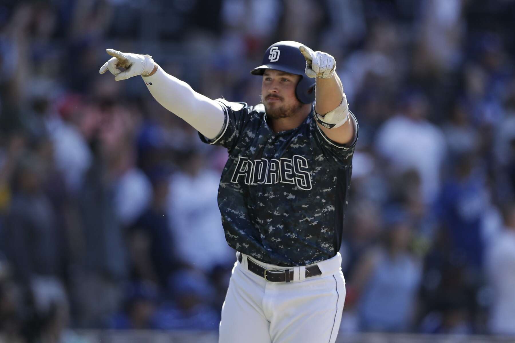 San Diego Padres' Hunter Renfroe hits a walkoff grand slam during the ninth  inning of a baseball game against the Los Angeles Dodgers, Sunday, May 5,  2019, in San Diego. (AP Photo/Gregory